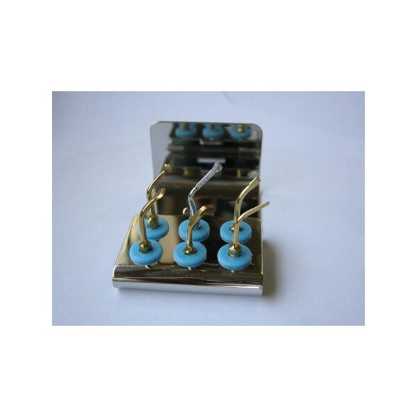 BASIC KIT dental scaler tools with blue holders, arranged on a metal tray.