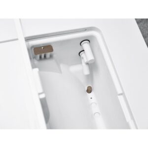 Close-up of the B CLASSIC - 17 LITRES bidet nozzle and spray inside a toilet unit.