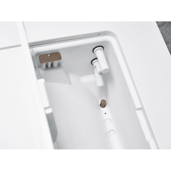 Close-up of the B CLASSIC - 17 LITRES bidet nozzle and spray inside a toilet unit.