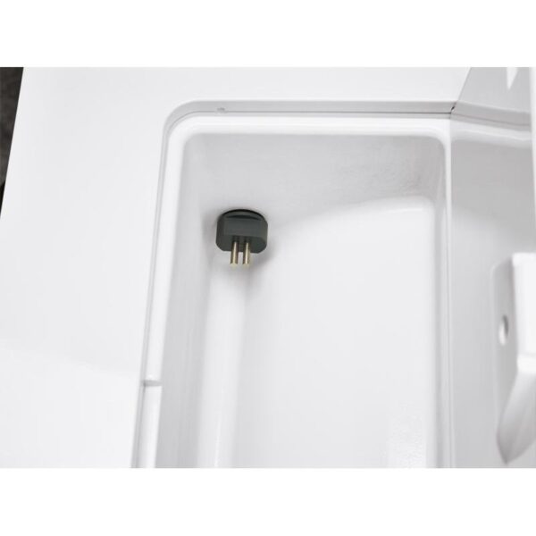 Close-up of a B CLASSIC - 28 LITRES white compartment with a black plug inside.