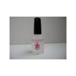 CUTICLE REMOVER in clear glass bottle with black cap, pink label on white surface.