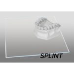 A dental model rests on a clear acrylic sheet labeled SPLINT-1 MM.
