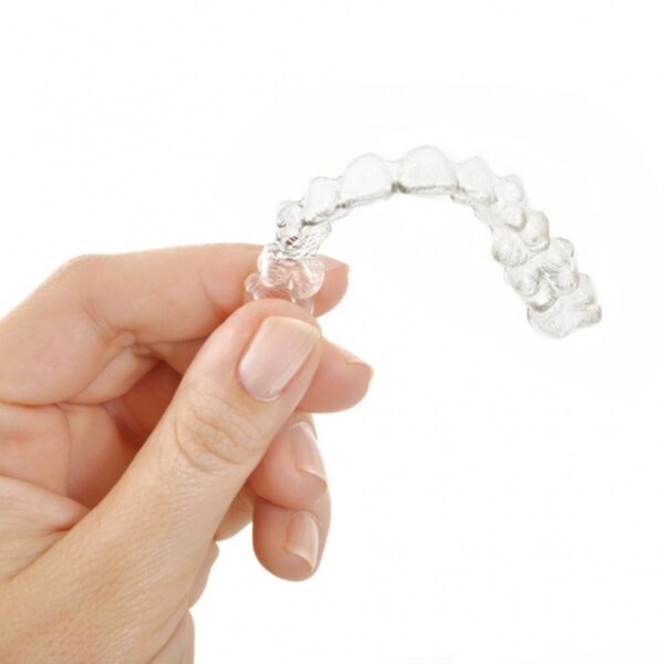 A hand holds a GHOST ALIGNER - 0,50 MM - Ø 120 against a white background.