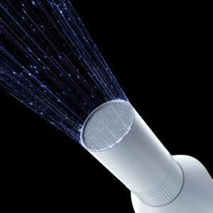 Soffione bianco che spruzza flussi d'acqua, come un Ai Ray Scanner endorale portatile.